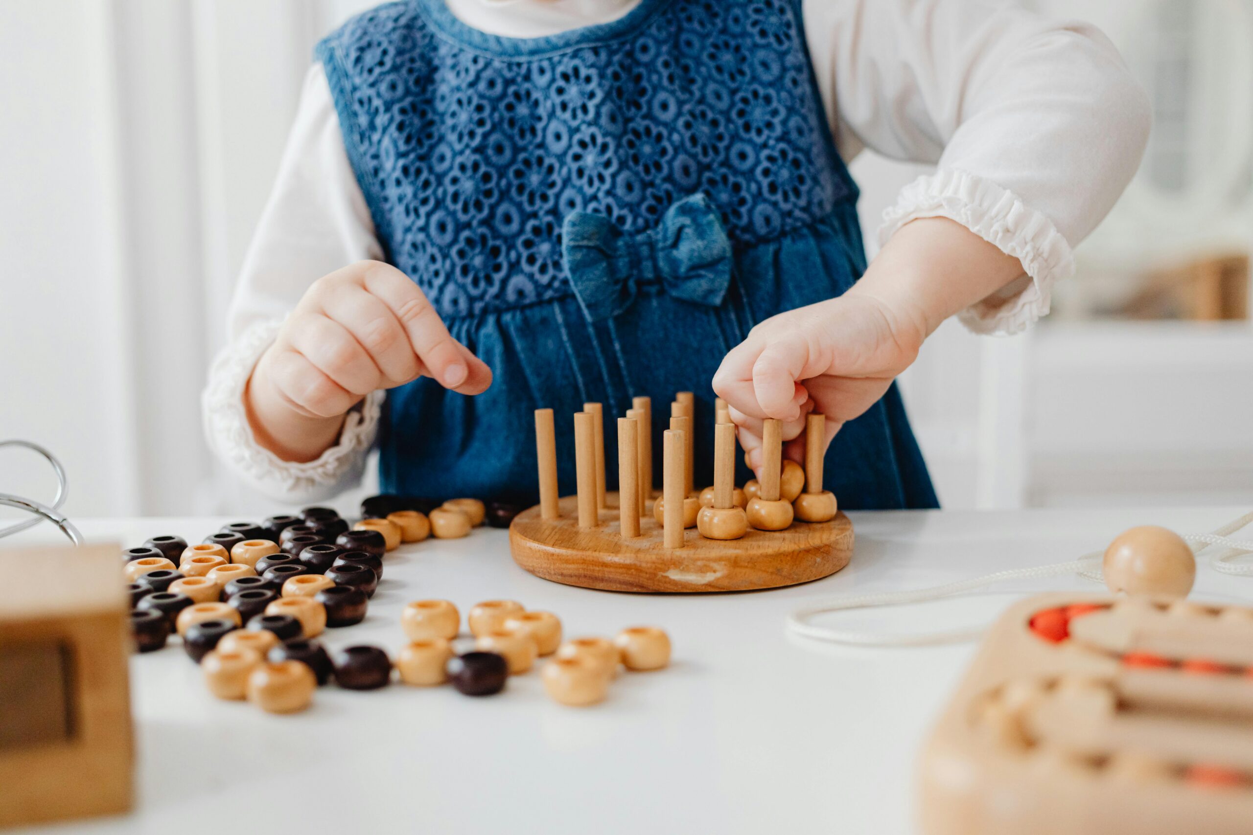 Child playing with wooden toy