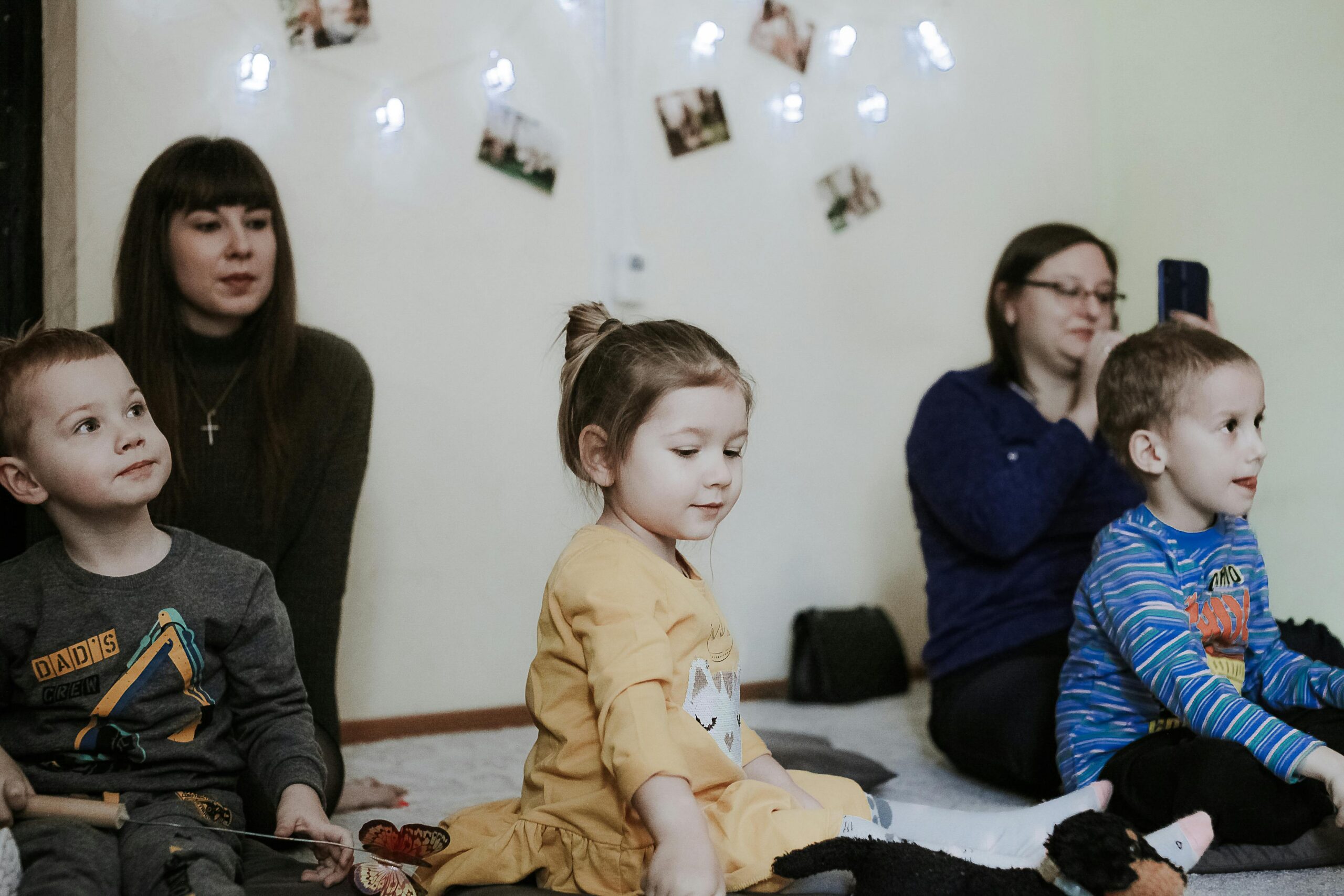 Children sitting with parents